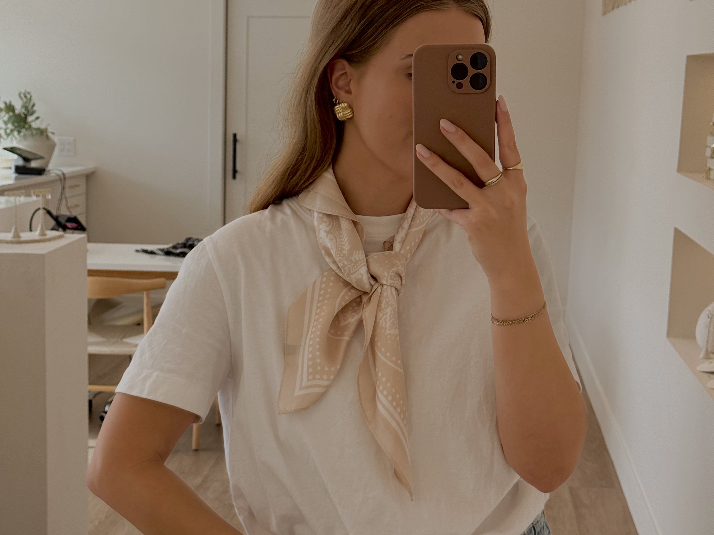 Fashion silky scarf by L&G in 65cm square design for stylish layering and accessorizing wear by a model
